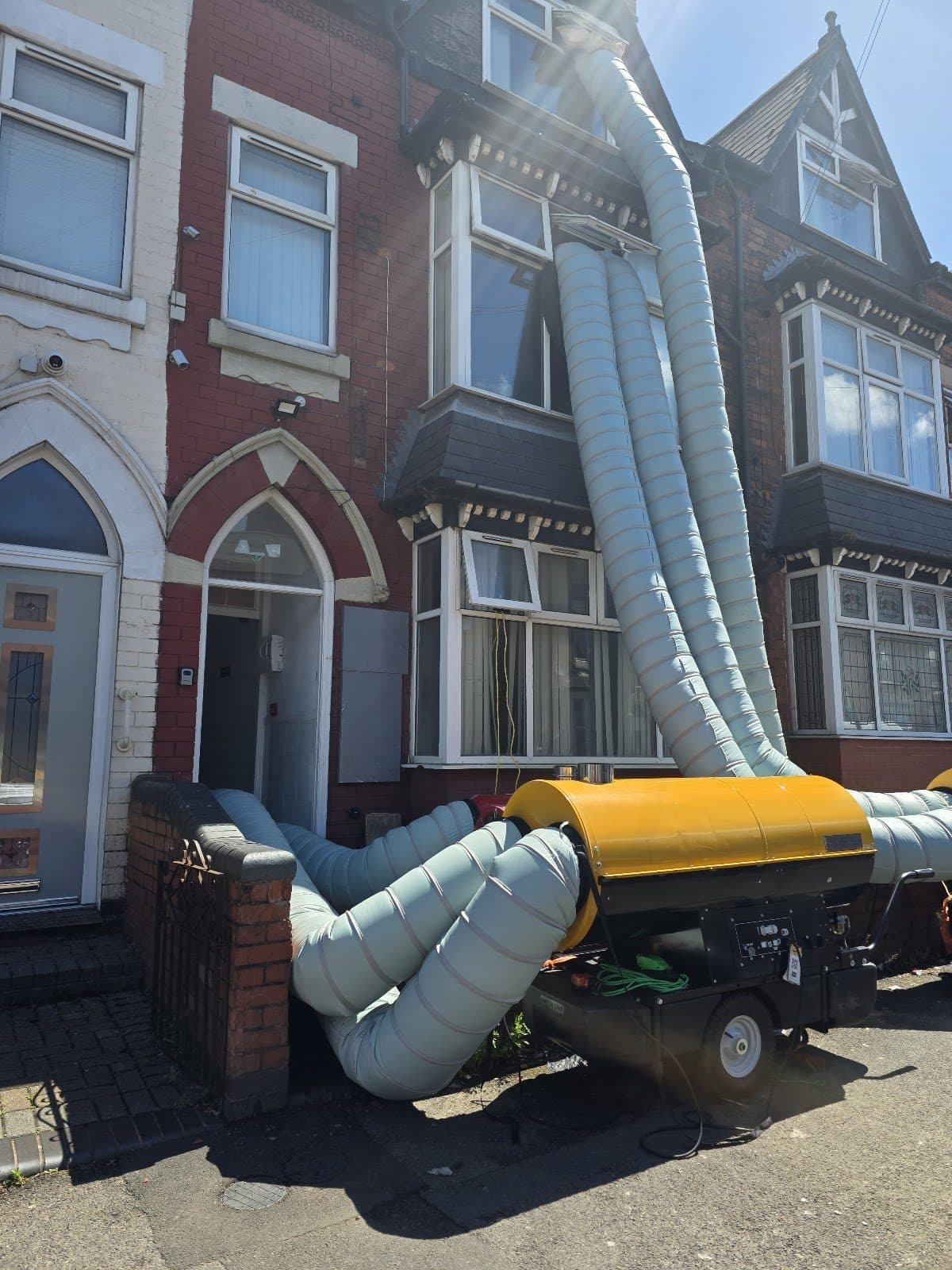 Bed bug heat treatment in progress — industrial heater and ducting at a Birmingham house